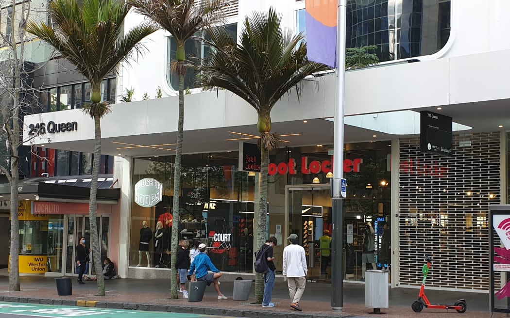 Young people waiting for Foot Locker Queen Street to open.