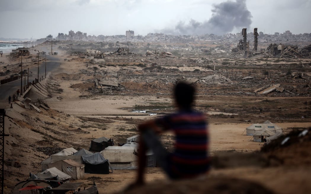 Smoke billows after Israeli bombardment of the Nuseirat refugee camp in northwest Gaza on 9 October.
