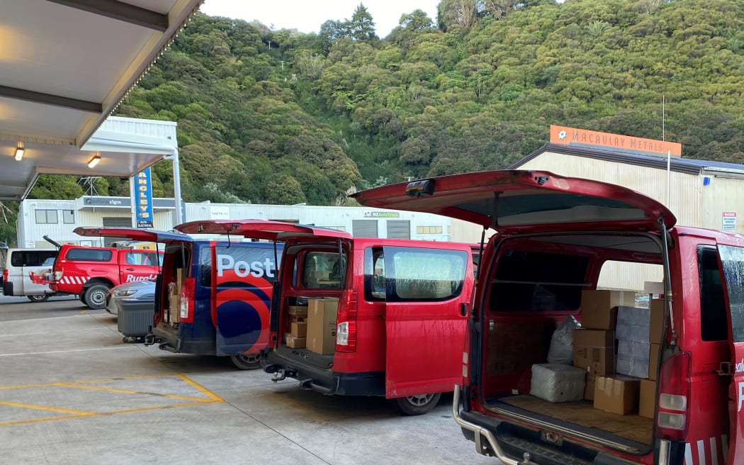 Postal vans packed with mail and parcels for the day ahead.