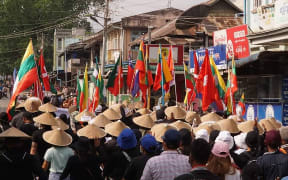 This handout from Shwe Phee Myay News Agency taken and released on May 2, 2021 shows protesters taking part in a demonstration against the military coup on "Global Myanmar Spring Revolution Day" in