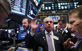 New York Stock Exchange traders at work the morning after Donald Trump the presidential election.