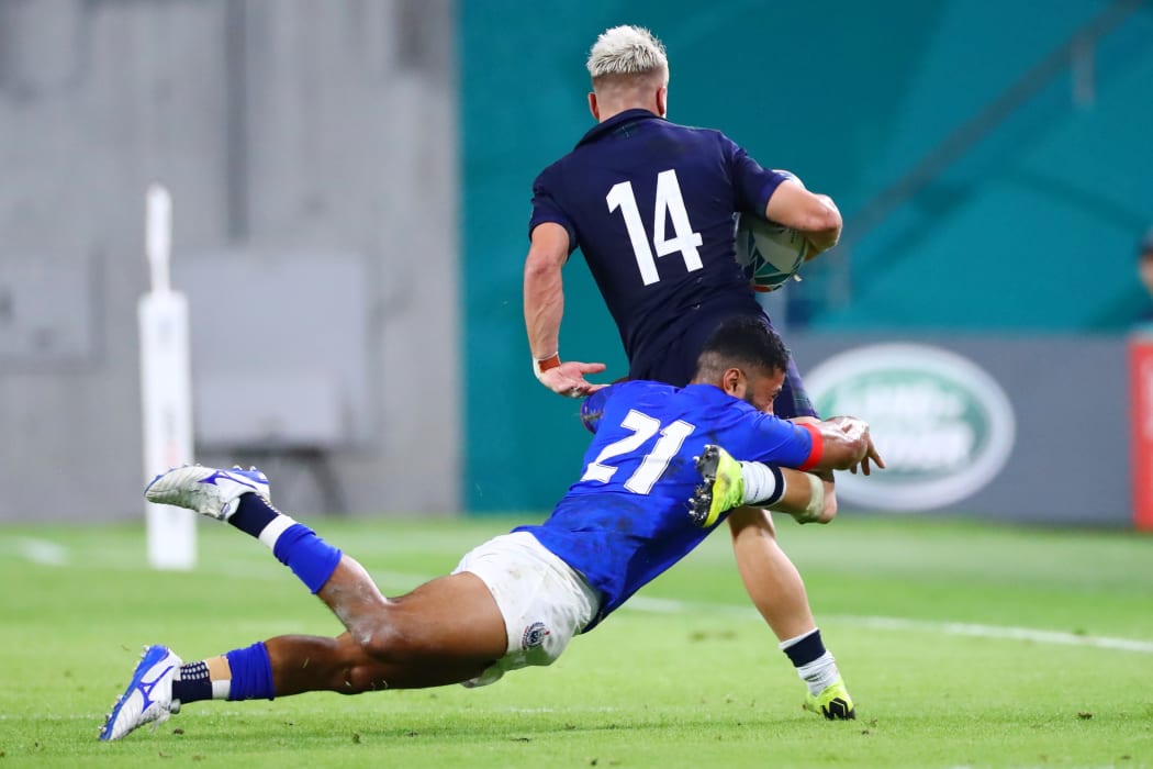 Halfback Pele Cowley makes a tackle during Samoa's 2019 Rugby World Cup match against Scotland.