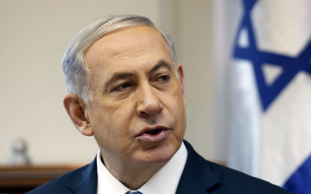 Israeli PM Benjamin Netanyahu opens the weekly cabinet meeting at his Jerusalem office on 28 December 2014.