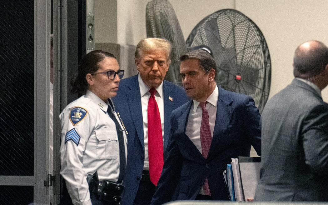 NEW YORK, NEW YORK - APRIL 15: Former U.S. President Donald Trump returns from a break as jury selection begins in his trial at Manhattan Criminal Court on April 15, 2024 in New York City. Former President Donald Trump faces 34 felony counts of falsifying business records in the first of his criminal cases to go to trial.   Jeenah Moon-Pool/Getty Images/AFP (Photo by POOL / GETTY IMAGES NORTH AMERICA / Getty Images via AFP)