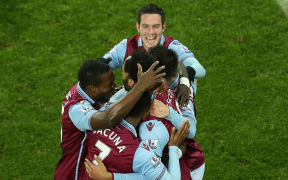 Aston Villa players celebrate a win.