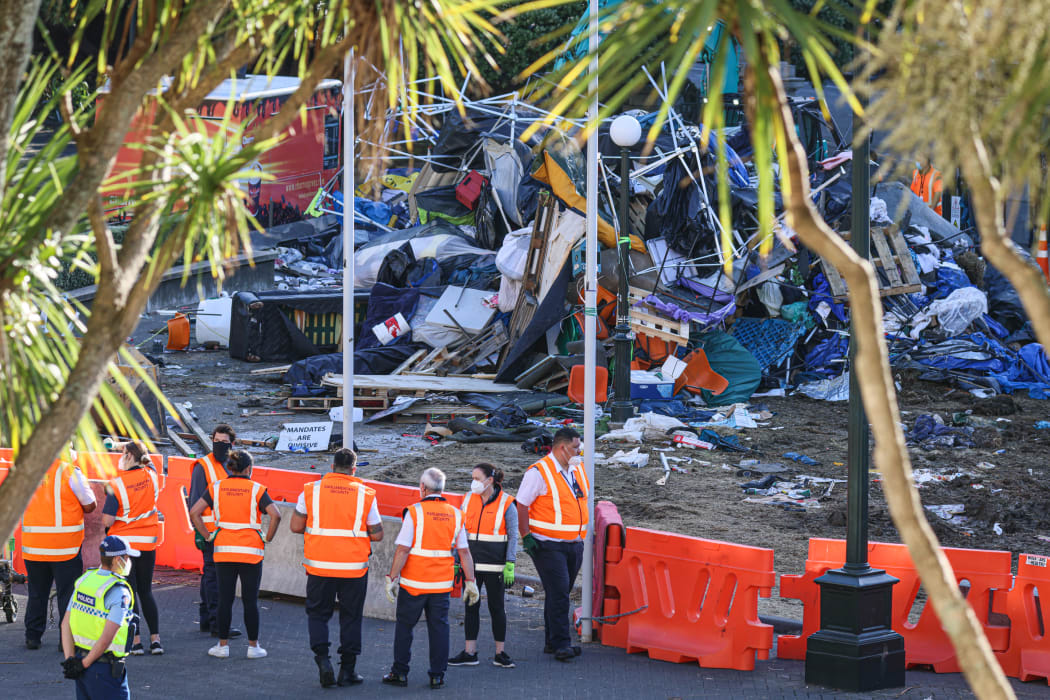 Parliamentary Security survey part of the rubbish dump where Parliament's lawn used to be.
