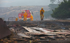 Firefighters work to contain a bushfire near Scotsburn, South of Ballarat in Victoria, Sunday, Dec 20.