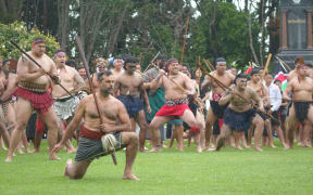 Hundreds of Māori toa, warriors, welcome officials on Owae Marae in Waitara for the commemorations of the New Zealand Land Wars.