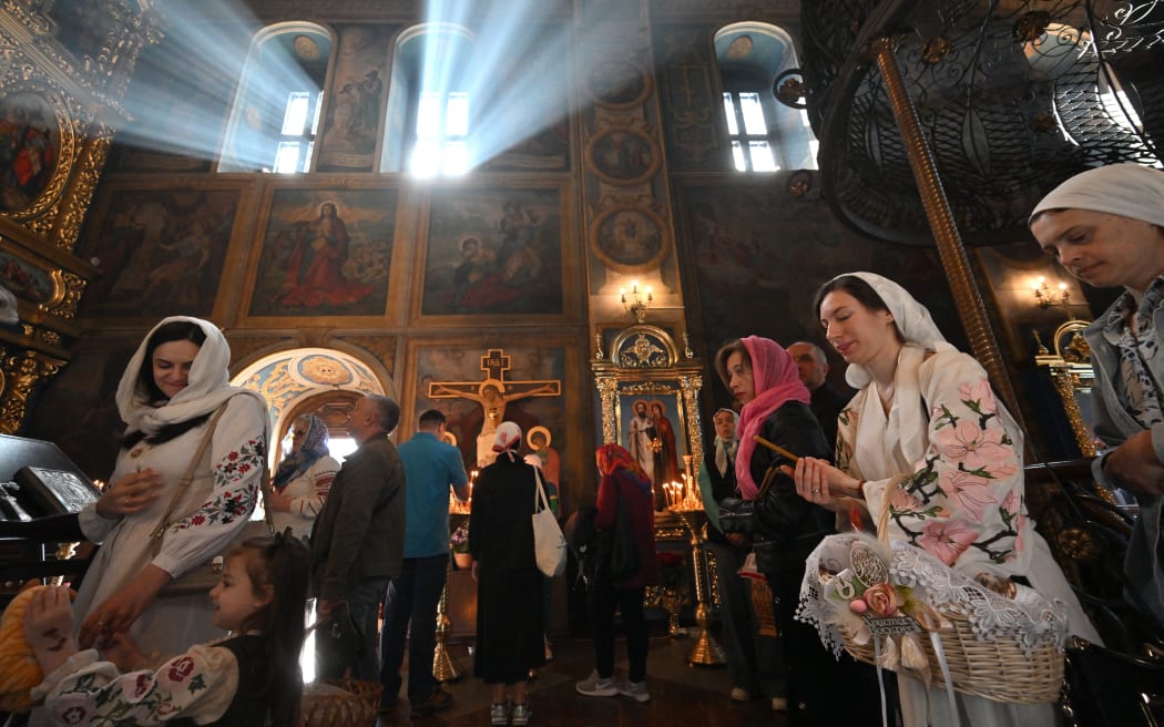 Orthodox worshippers attend an Easter service in Saint Michael's Golden-domes Cathedral in Kyiv on Sunday 20 April, 2025, amid the war in Ukraine, and accusations from both Russia and Ukraine of breaking a one-day ceasefire.