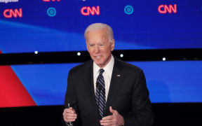 Former Vice President Joe Biden delivers his closing statement during the Democratic presidential primary debate at Drake University on January 14, 2020.