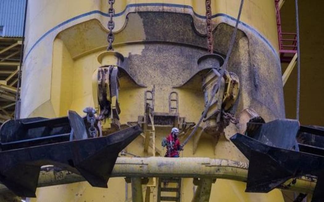 A Greenpeace activist scales the Polar Pioneer drill rig in the Pacific Ocean.