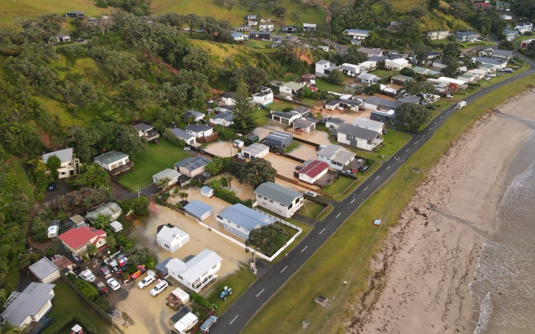 Floodwaters at Ōakura Bay as seen from the air.