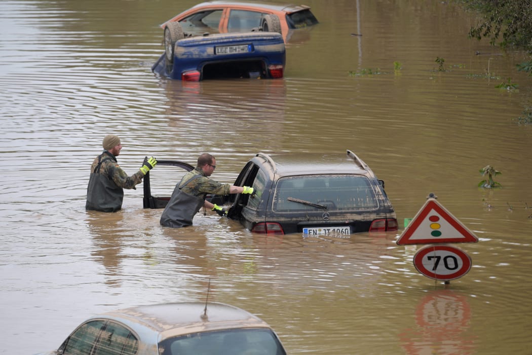 Soldiers search for flood victims in submerged vehicles on a federal highway in Erftstadt, western Germany. on 17 July 2021, after heavy rains hit parts of the country, causing widespread flooding and major damage.