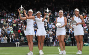 Wimbledon Tennis Championships 2021, Ladies doubles final;  Su-Wei Hsieh TPE and Elise Mertens Belgium pose with their winners trophies next to finalists Elena Vesnina and Veronika Kudermetova of Russia