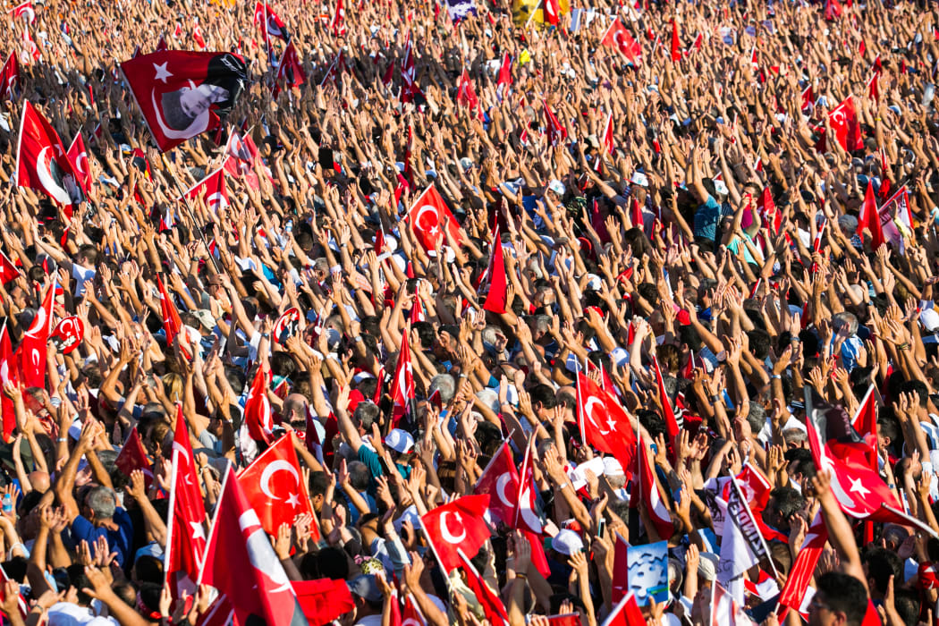 Tens of thousands of people take part in a pro-democracy rally in Istanbul, condemning the nation's attempted coup.