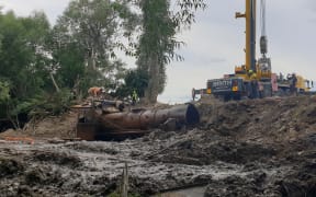 The locomotives were filled with tonnes of silt and river muck, so hauling them out required a huge effort.