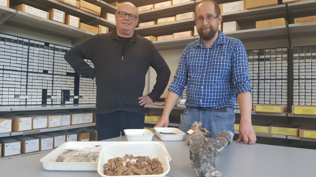 Richard Walter and Nic Rawlence with bone fragments and moa bones in the Advanced Laboratory at the University of Otago.