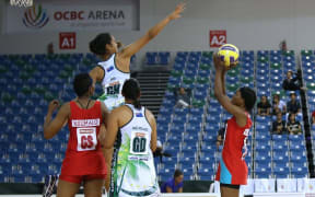 Cook Islands GK Anania Pauleen Piri leaps high v Swaziland
