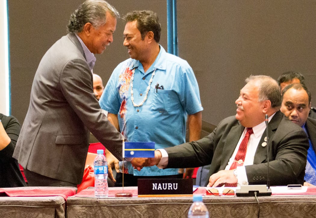 Cooks Islands Henry Puna meets Nauru's Baron Waqa at a meeting of Small Island states before the Pacific Islands Forum 2015