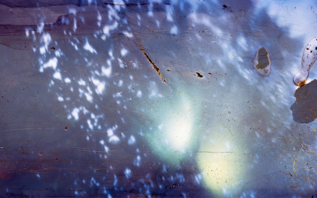 Clay, stone, sticks, frond stem of mamaku, water, light, 87 centimeters x 2.5 meters, Archival Inkjet Print, 2023