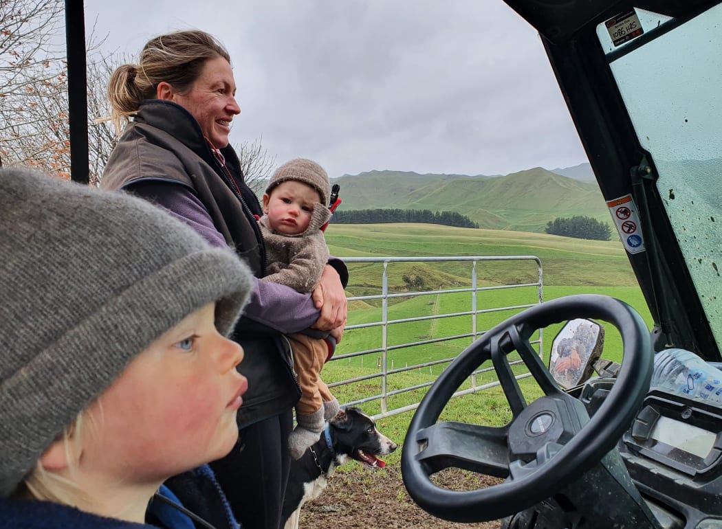 Mairi checking on the ewes with two year old Tad and Lachie in the front pack
