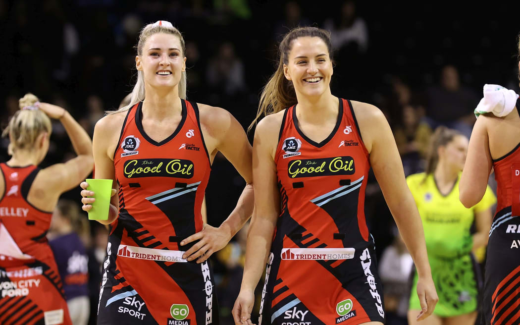 Tactix captain Jane Watson (L) with Sophia Fenwick after beating the Pulse.