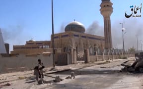 An image grab taken from a video uploaded by Aamaq news agency allegedly showing IS fighters in Ramadi.