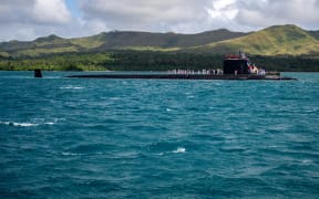 The Virginia-class nuclear powered submarine USS Minnesota arrives at the US Naval Base Guam, on 26 November 2024.