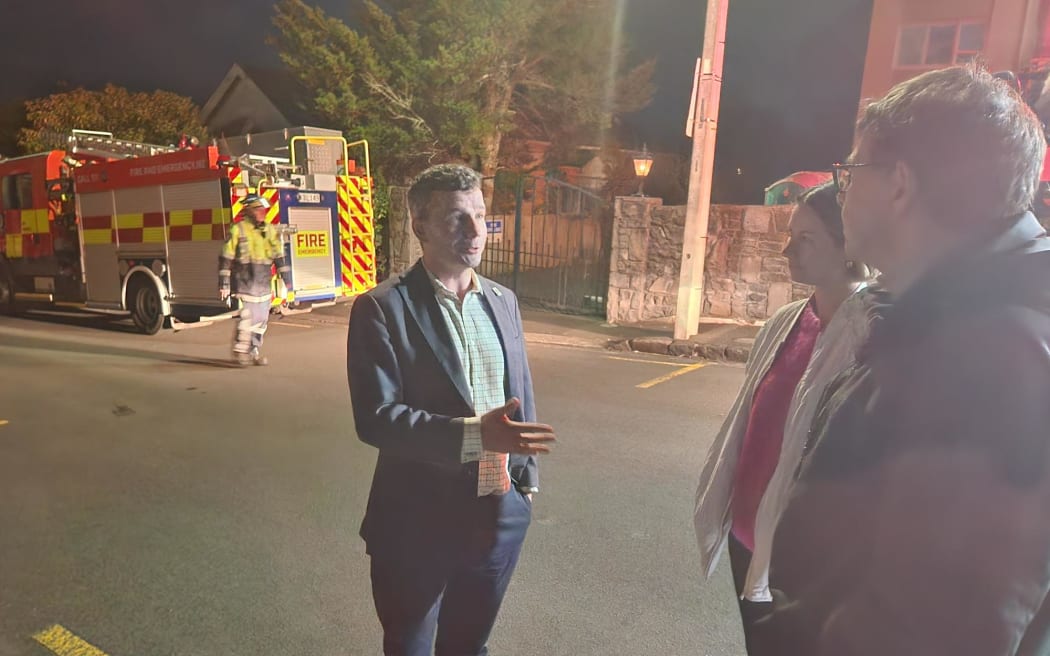 David Seymour talks to residents at the scene of the fire.
