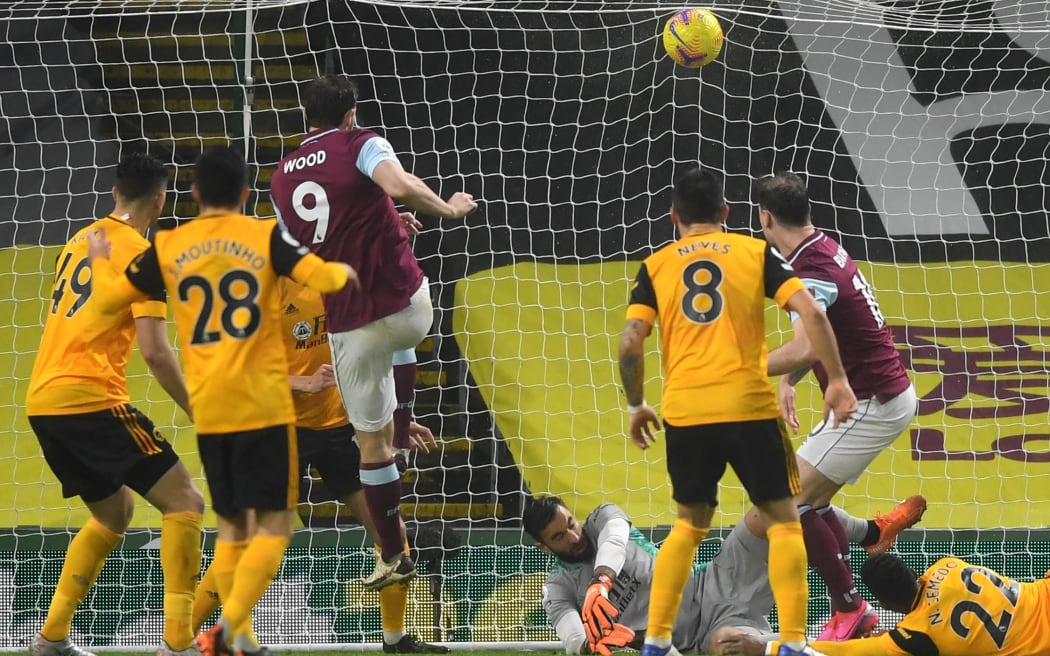 Burnley's New Zealand striker Chris Wood (centre left) scores their second goal during the English Premier League football match against Wolverhampton Wanderers at Turf Moor in Burnley.
