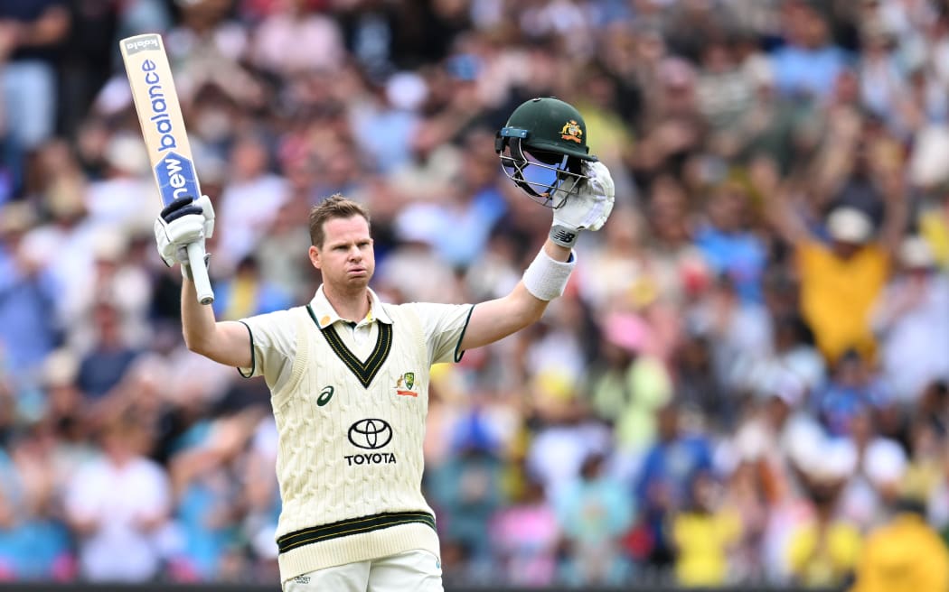 Steve Smith of Australia celebrates making a century during the fourth test against India.