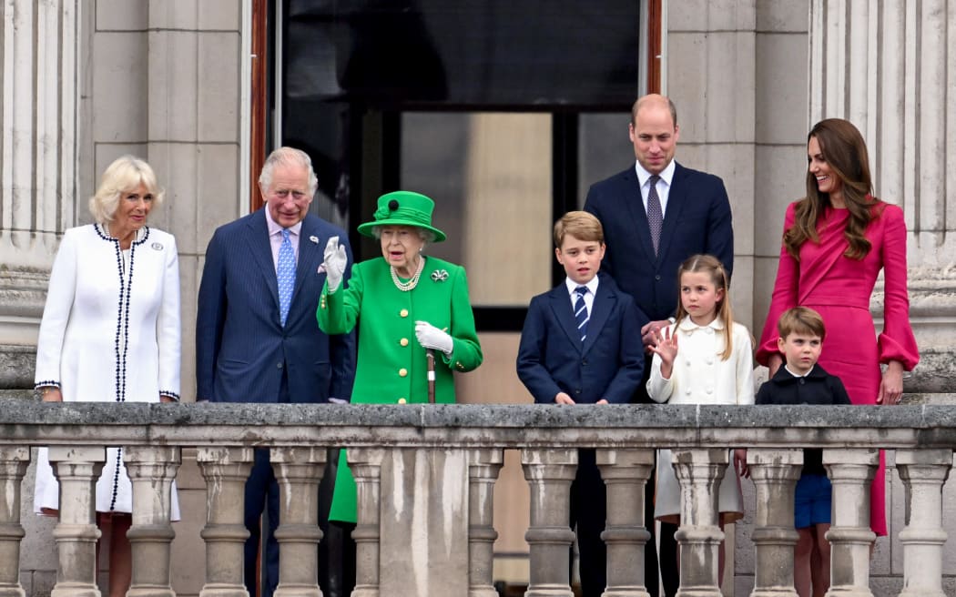 Britain's Queen Elizabeth II stands on Buckingham Palace balcony with (from left) Camilla, Prince Charles, Prince George, Prince William, Princess Charlotte Catherine, and Prince Louis at the end of the Platinum Pageant in London on 5 June 2022 as part of Queen Elizabeth II's platinum jubilee celebrations.