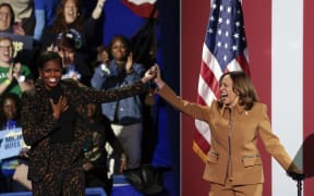 US Vice President and Democratic presidential candidate Kamala Harris and former US First Lady Michelle Obama campaign together at the Wings Event Center in Kalamazoo, Michigan, 26 October, 2024.