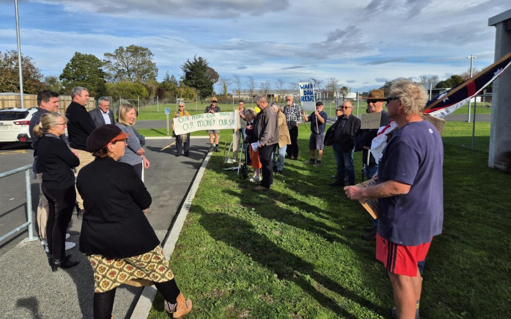 Wise Water Use protestors peacefully talk to Centralines' Board Chair and Trustees.