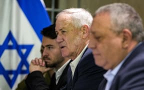 Former Israeli Defence Minister Benny Gantz (2nd-R) and former Israeli army chief of staff Gadi Eisenkot (R), both members of the current Israeli five-person war cabinet led by Prime Minister Benjamin Netanyahu, meet with the visiting US Secretary of State in Tel Aviv on February 8, 2024. (Photo by Mark Schiefelbein / POOL / AFP)