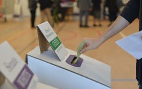 A man casts his vote at a polling station during general elections to elect its parliament and prime minister in Melbourne, Australia on May 18, 2019.