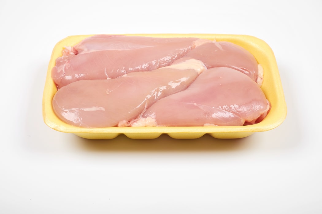 Raw chicken fillet package