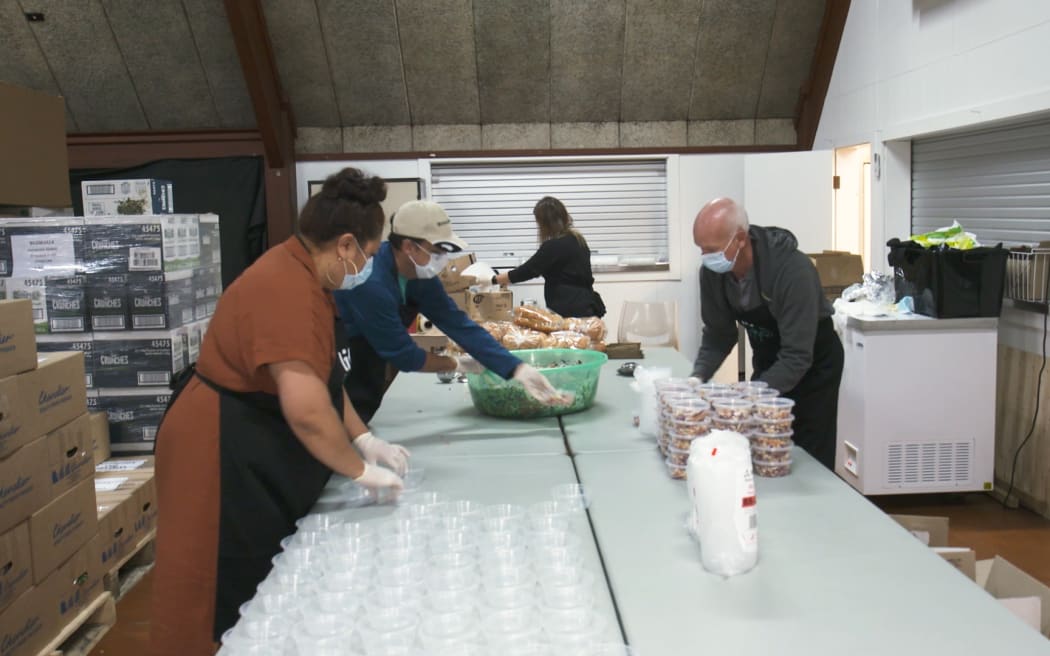 Volunteers prepare meals at Papakura Marae for those in need as unemployment rises.