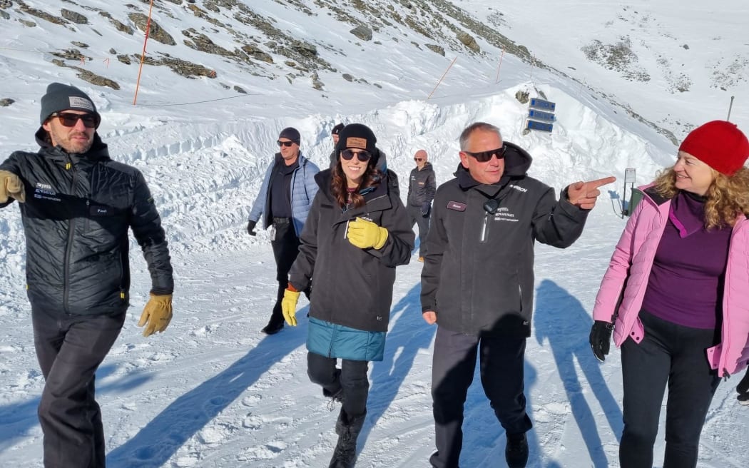 NZSki chief executive Paul Anderson (left) and Prime Minister Jacinda Ardern at The Remarkables skifield in Queenstown on 18 June 2022.
