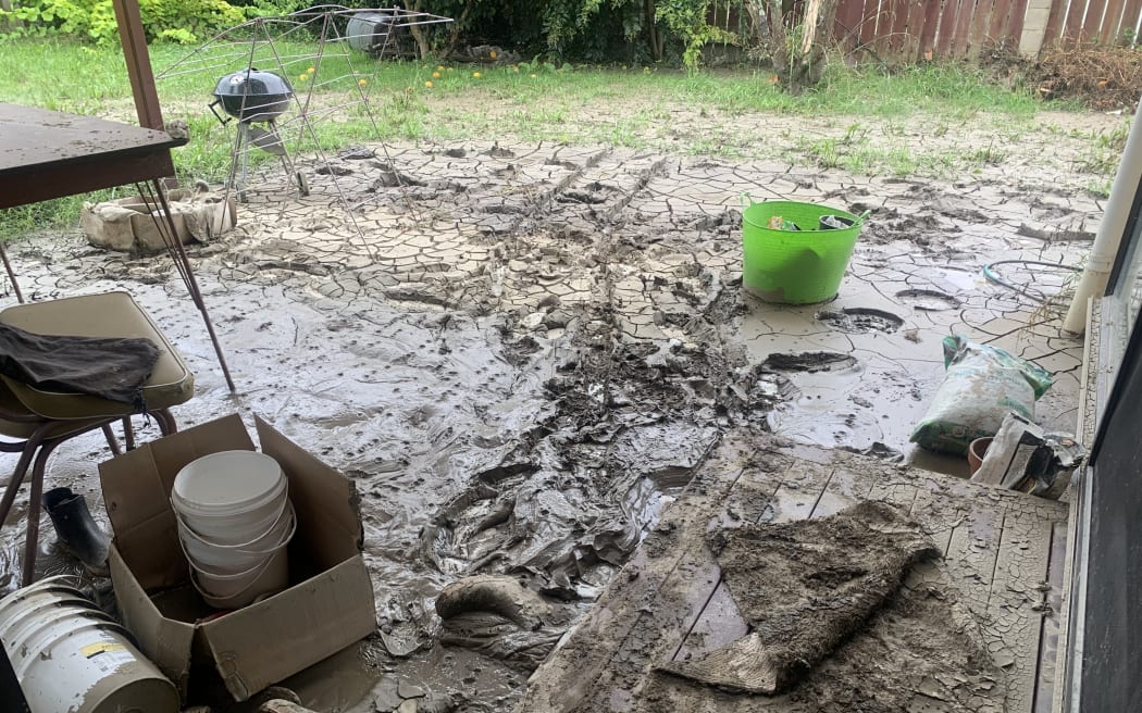Qian Zhang says they only had five minutes to get out of their Taradale house because the flood waters rushed in so quickly.