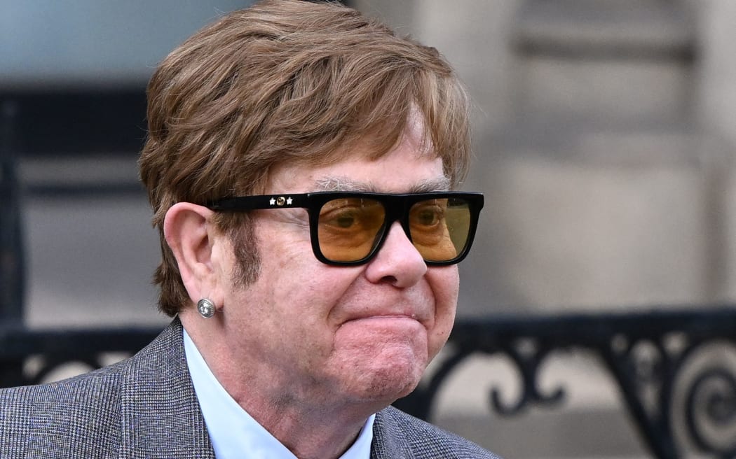 English singer Elton John leaves from the Royal Courts of Justice, Britain's High Court, in central London on March 27, 2023. (Photo by JUSTIN TALLIS / AFP)