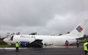 The Trigana 737 aircraft skidded for a kilometre on its belly along the runway before coming to rest to the side of the strip.