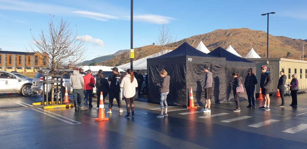 People queue at the one-day drive-through Covid-19 testing clinic in Frankton, operating from 9am to 5pm on Tuesday.