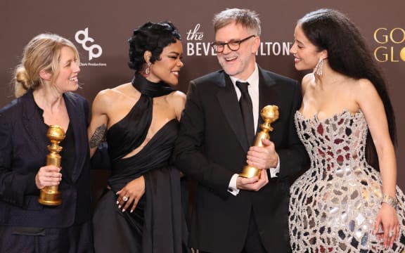 (L/R) US film producer Sara Murphy, US actress Teyana Taylor, US filmmaker Paul Thomas Anderson and US actress Chase Infiniti, winners of the Best Motion Picture - Musical or Comedy Award for "One Battle After Another", pose in the press room during the 83rd annual Golden Globe Awards at the Beverly Hilton hotel in Beverly Hills, California