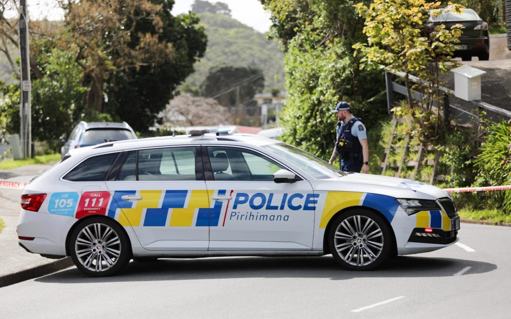 A police car is seen at blocking the road in Miramar, Wellington on 16 October, 2023, where a person was found dead at a residential address.