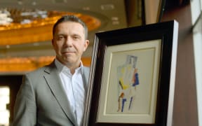 Olivier Picasso with his grandfather's painting.