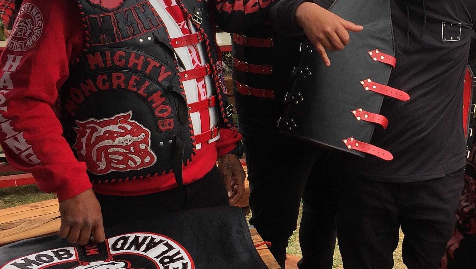 Mongrel mob member puts on patch for the first time.