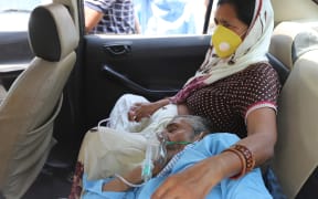 A Covid-19 patient gets oxygen on the spot provided by Sikh Organisation at a Gurdwara in Indirapuram, Ghaziabad, Uttar Pradesh, India on April 24, 2021.