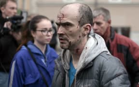 An injured man outside the Tekhnologichesky Institut station.