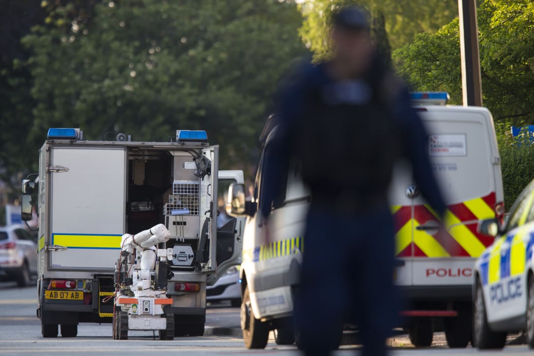 An army bomb disposal unit is parked nearby during a security operation at Springfield Street in Wigan, Greater Manchester.